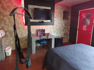 TV o dispositivi per l'intrattenimento presso Lizvan Hotel-Motel