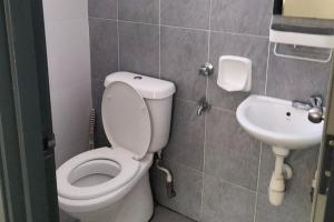 a bathroom with a toilet and a sink at Iris 32 3BR Corner Lot Wi-fi Mutiara Rini Skudai JB Malay Only in Johor Bahru +19 photos