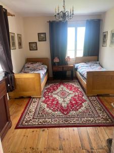 Ένα ή περισσότερα κρεβάτια σε δωμάτιο στο Dom wsród pól Radawczyk