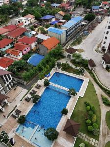 an overhead view of a large swimming pool in a city at Coastal Stay at Oceancrest in Cebu City