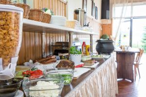 a kitchen with a counter with food on it at Pokoje Gościnne U Trebuni in Murzasichle