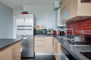 Kuchyň nebo kuchyňský kout v ubytování Appartement T4 avec tennis + 13 fotografií