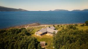an aerial view of a house on an island in the water at Grannen Lodge in Storheil