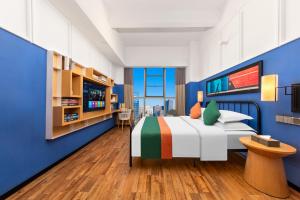 Postel nebo postele na pokoji v ubytování Happy Inn-Xinzheng International Airport Branch喜鹊愉家连锁酒店-机场店