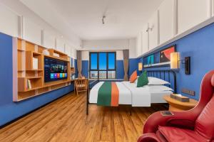 Postel nebo postele na pokoji v ubytování Happy Inn-Xinzheng International Airport Branch喜鹊愉家连锁酒店-机场店