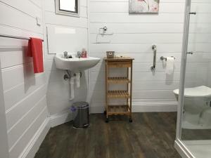 a bathroom with a sink and a toilet at Yallamatta Bed and Breakfast in Apsley +15 photos