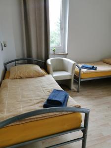 Ένα ή περισσότερα κρεβάτια σε δωμάτιο στο Luitpoldapartment