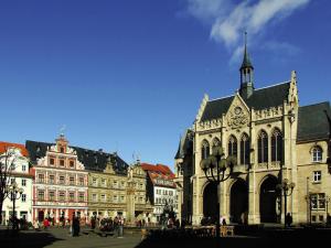 a group of buildings in a city with a church at IntercityHotel Erfurt in Erfurt