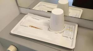 a table with a white tray with a toothbrush and aucer at Hotel Gran View Okinawa in Takara +104 photos