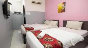 Kampong Kuala PuntiにあるHotel CheckedInnのギャラリーの写真