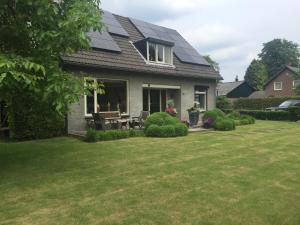 a house with solar panels on the roof at Bed en Breakfast De Kees in Eersel