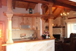 a kitchen with wooden cabinets and a counter top at Apartment Stanisic in Budva