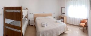 Postel nebo postele na pokoji v ubytování Hotel Elisabetta
