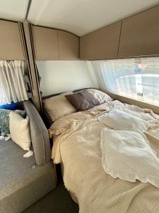 Voodi või voodid majutusasutuse Apartmány Zahražany Karavan toas +5 fotot
