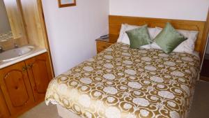 Postel nebo postele na pokoji v ubytování Ponderosa B&B