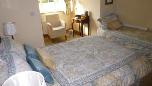 Postel nebo postele na pokoji v ubytování Ponderosa B&B
