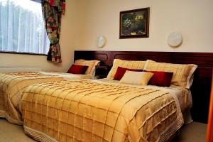 Postel nebo postele na pokoji v ubytování Ponderosa B&B