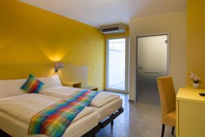 Ένα ή περισσότερα κρεβάτια σε δωμάτιο στο Hotel Liberty Self Check-In