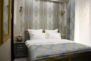 Postel nebo postele na pokoji v ubytování Neapol Boutique Hotel