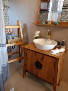 a bathroom with a sink and a mirror at Sofilia view house in Argilia +32 photos