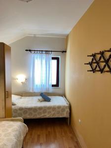 Postel nebo postele na pokoji v ubytování Apartments Frakić