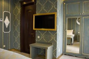 Postel nebo postele na pokoji v ubytování Neapol Boutique Hotel