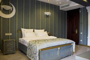 Postel nebo postele na pokoji v ubytování Neapol Boutique Hotel