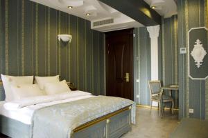Postel nebo postele na pokoji v ubytování Neapol Boutique Hotel