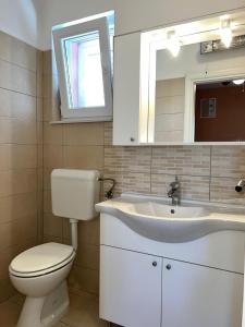 Koupelna v ubytování Apartments Frakić