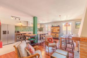 a kitchen with a table and chairs in a room at Talaia - baskeyrentals in Ondárroa