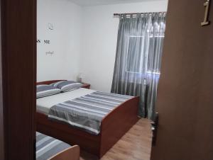 Postel nebo postele na pokoji v ubytování Krka Ivan