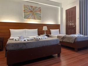 Voodi või voodid majutusasutuse Zosimo's Inn toas