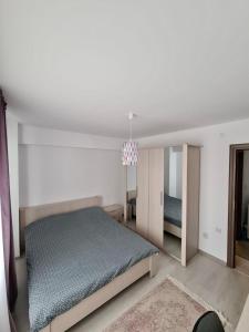 Katil atau katil-katil dalam bilik di Apartament Oradea