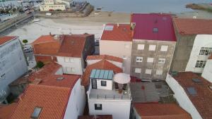 an aerial view of a city with roofs at Casa PedraMar in O Grove