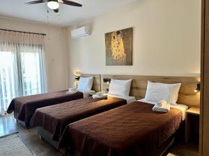 Postel nebo postele na pokoji v ubytování Dili Apartments