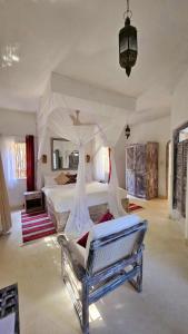 Postel nebo postele na pokoji v ubytování Asha Boutique Hotel