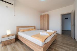 Postel nebo postele na pokoji v ubytování Saraj Apart Hotel