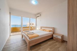 Postel nebo postele na pokoji v ubytování Saraj Apart Hotel