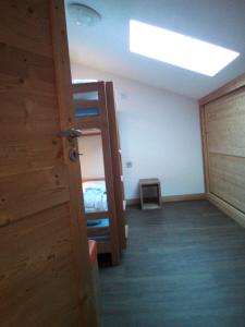 a room with a bunk bed and a door at apartment for 6 people in Béranger