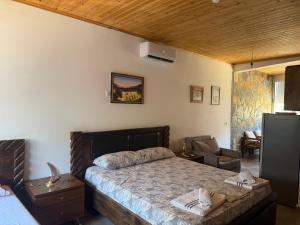 Postel nebo postele na pokoji v ubytování Jardin miraculeux