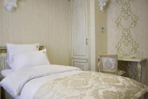 Postel nebo postele na pokoji v ubytování Neapol Boutique Hotel
