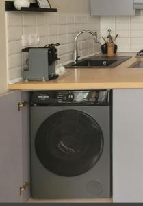 Cuisine ou kitchenette dans l'établissement Appartement idéal pour découvrir la ville
