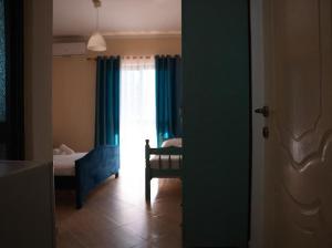 Postel nebo postele na pokoji v ubytování OKEJ Hotel