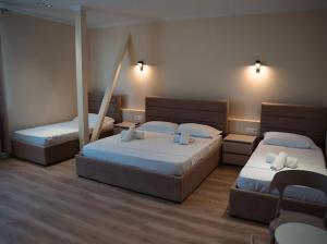 Postel nebo postele na pokoji v ubytování OKEJ Hotel + 37 fotografií