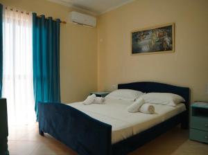 Postel nebo postele na pokoji v ubytování OKEJ Hotel