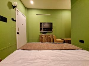 Hotel Aurelia Pearl客房内的一张或多张床位