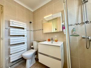 a bathroom with a toilet and a sink and a shower at L'Escapade du Midi in La Celle-sous-Gouzon +48 photos