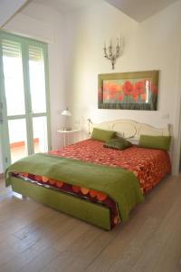 En eller flere senge i et værelse på Monolocale Onda Etrusca vacanza per due al mare