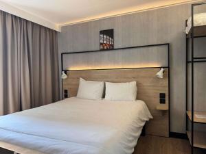 Postel nebo postele na pokoji v ubytování ibis Limoges Centre