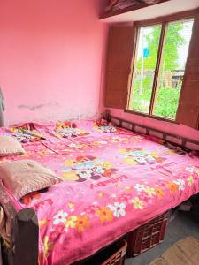 Postel nebo postele na pokoji v ubytování Shiva Homestay